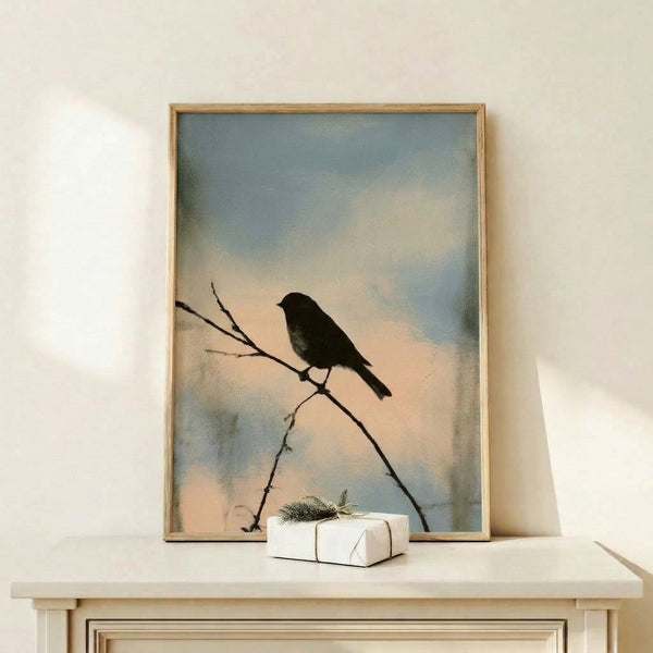 Serene bird silhouette watercolor painting in grey-brown and black tones with soft blue background, displayed as a framed wall print.