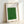 Framed zen landscape art depicting cranes in a green field rendered in traditional Japanese minimalist technique with cream and olive tones.