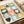 Modern botanical grid poster featuring organized arrangement of abstract flowers in soft blue, golden yellow, and muted earth tones.