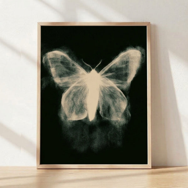 Minimalist line art poster depicting delicate moth wings in black and cream tones, framed on a wall with a serene, ethereal aesthetic.