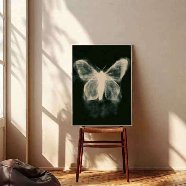 Cream and charcoal botanical line art print showing detailed moth wing patterns in a minimalist contemporary frame.