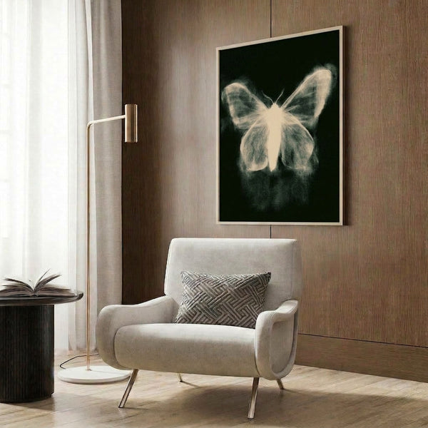 Modern wall art featuring ethereal butterfly wing illustration rendered in simple black lines on a pale cream background, framed for display.