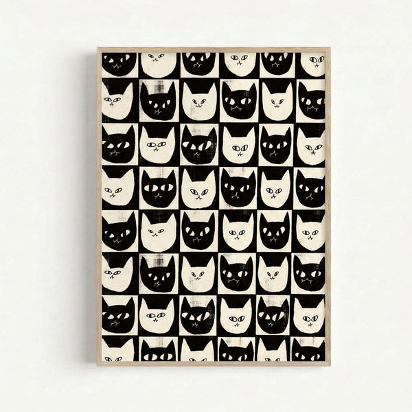 Framed black and white minimalist cat art print displaying multiple stylized feline faces arranged in a retro checkerboard layout with a playful mood.