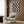 Black and cream checkerboard poster displaying multiple stylized cat faces in a playful, minimalist retro design suitable for contemporary wall decor.