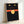 Modern minimalist art print of stylized black cat face with expressive yellow eyes and coral accent, wall decor.