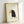 Whimsical bird art print featuring a charming crow in a minimalist style with navy blue, golden yellow, and black accents on cream, hung as a framed poster.