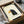 Quirky crow poster in contemporary minimalist design with navy, gold, and black accents against cream, showcasing whimsical character art in a frame.