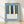 Minimalist framed poster art print featuring a piano keyboard in slate blue, cream, and black with clean geometric lines and Bauhaus-inspired design.