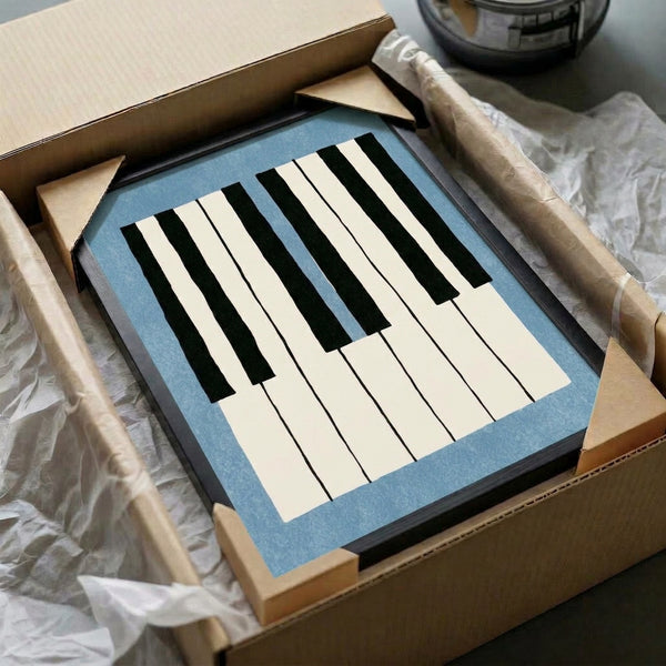 Sleek Bauhaus-style art print of piano keys rendered in slate blue and black on cream, creating a calm and sophisticated modern aesthetic.