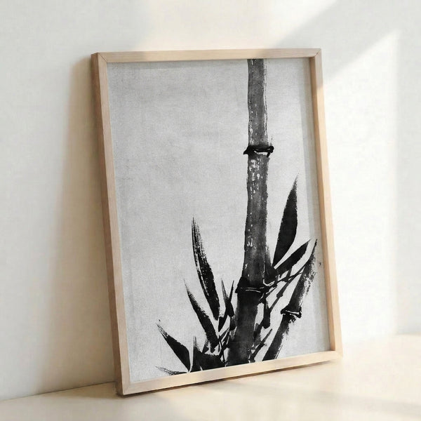 Stark botanical study of bamboo with minimal brushstrokes, a climbing lizard, and negative space, creating a zen-inspired framed wall artwork in black and white.