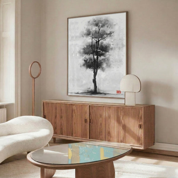 Abstract watercolor wall art of a single tree with flowing ink branches in grayscale palette, conveying melancholic beauty and zen simplicity.