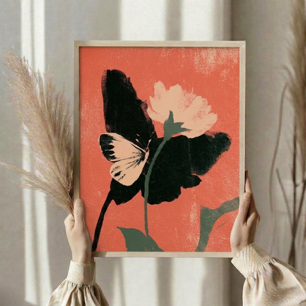 Abstract minimalist art print of a coral butterfly surrounded by botanical motifs in cream, black, and teal tones, displayed as framed wall decor.