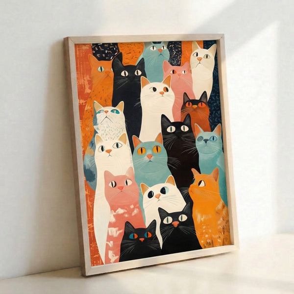 Bold animal wall art showing a group of expressive cats in warm orange, cool teal, and cream hues with a modern whimsical aesthetic.