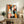 Modern line art animal print featuring multiple colorful cat faces in bold coral, teal, and orange against a cream backdrop, displayed as framed wall decor.