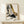 Stylish fashion illustration featuring sleek high heels rendered in simple black lines with gold accents, displayed as a framed contemporary art print in neutral tones.