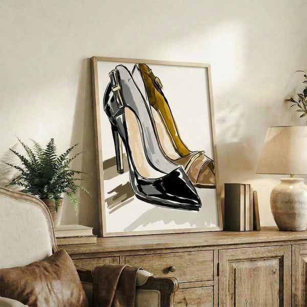 Modern line drawing of fashionable high heels in black ink with gold details on a soft cream backdrop, presented as a trendy framed poster for contemporary home decor.
