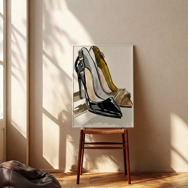 Sophisticated black line art of chic high heels accented with gold, mounted as a framed minimalist fashion print with an elegant cream and white color scheme.