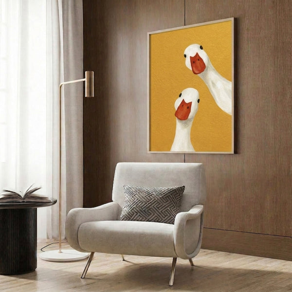 Japandi-inspired framed wall art of a silly goose duo, minimalist design in warm yellows and red-orange with whimsical character.
