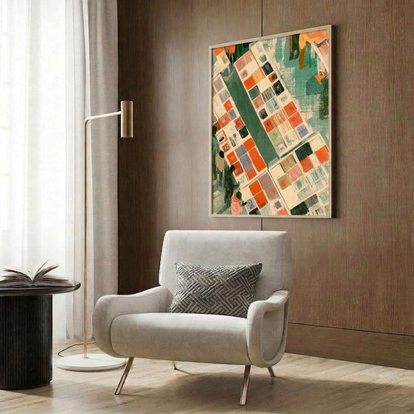 Framed abstract wall art combining black lines and organic shapes in orange, teal green, and cream, depicting a thoughtful, minimalist interpretation of a busy street market or library scene.