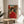 Framed modern art print blending geisha tradition with street-style attitude; features sunglasses-wearing figure in dynamic red and black with calligraphic elements and urban backdrop.