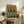 Modern art print displaying abstract wine bottles adorned with organic striped patterns in earthy burgundy and green hues with a structured Bauhaus aesthetic.