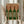 Contemporary framed poster showcasing geometric wine bottle forms with zebra-like wood grain textures in warm cream, burgundy, and forest green colors.