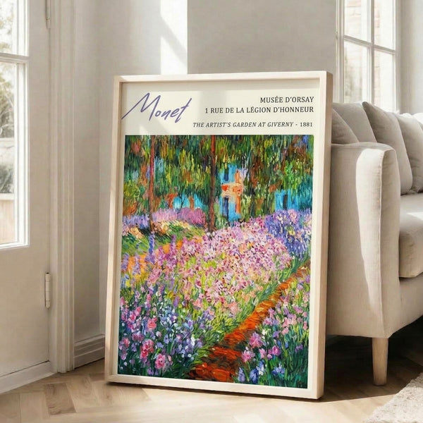 Framed art print depicting Monet's serene garden at Giverny with soft brushstrokes, romantic flower beds, and peaceful foliage in blues, purples, and warm orange hues.