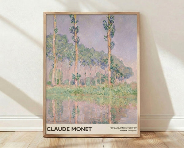 Impressionist painting of poplar trees reflected in water with soft lavender, rose pink, and pale yellow tones, capturing a serene atmospheric landscape framed on a wall.