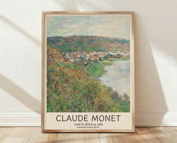 Impressionist landscape painting of Vetheuil village nestled by a calm river, with soft blue water, sage green foliage, and terracotta-toned cliffs under a pale yellow sky.