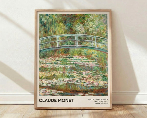Impressionist framed poster of Monet's Japanese bridge spanning a serene pond with water lilies, soft greens and blues creating a peaceful, contemplative garden scene.