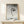 Zen-inspired framed print featuring a hanging monkey amid sparse foliage, rendered in pale blues and grays with the quiet elegance of classic Japanese printmaking.