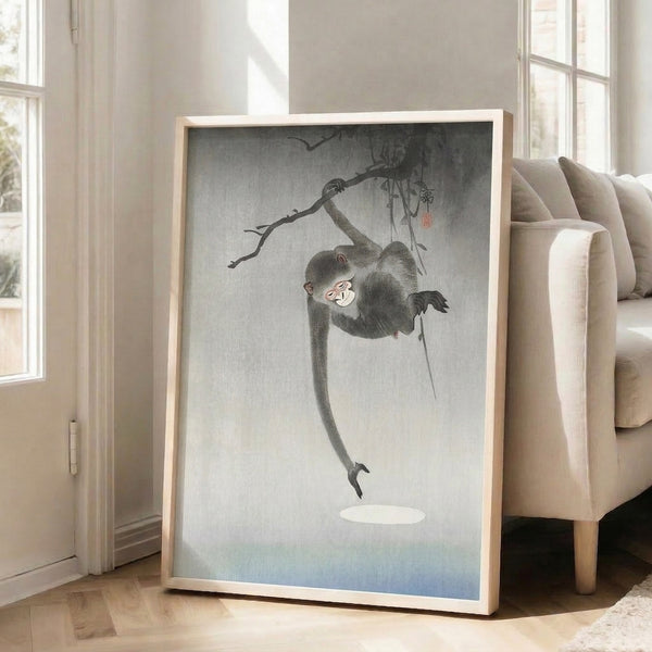 Japanese woodblock-style poster of a whimsical monkey on a branch, employing restrained grays and whites with touches of red for a serene, nature-focused composition.