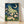 Art Nouveau framed poster featuring a luna moth among night-blooming flowers and ferns in teal, cream, and gold tones, evoking dreamy nocturnal magic.
