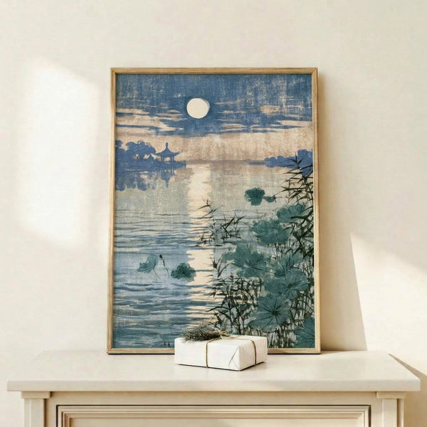Contemplative Japandi art print depicting a tranquil water landscape with floating lotus flowers, a distant pagoda, and bamboo framed on a wall; soft color palette of deep teal, cream, and gold creates a meditative mood.