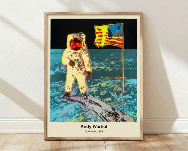 Pop art style framed poster featuring an astronaut in a spacesuit on the moon, rendered in bold black, white, and silver tones with a historic and iconic mood.