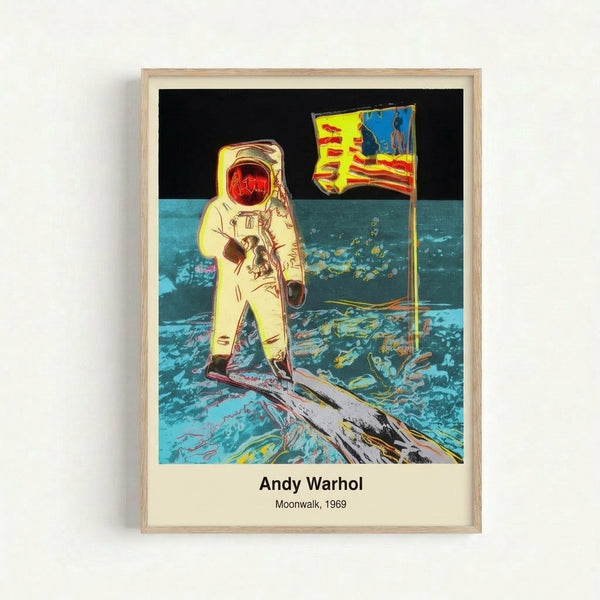 Framed modern art print depicting the Apollo 11 moonwalk in vibrant pop art style, with high contrast grayscale and metallic silver accents celebrating space exploration.