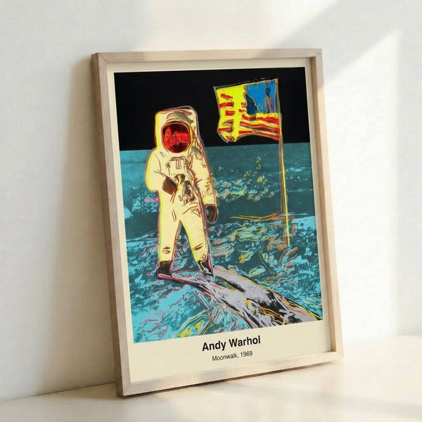 Contemporary pop art wall print showing an astronaut figure against the lunar surface in striking black and white with silver highlights, evoking the bold spirit of 1969.