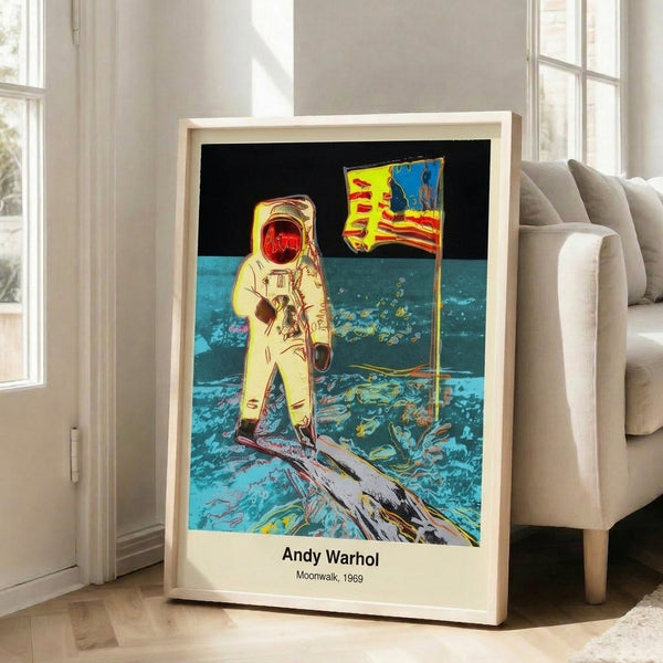Pop art framed print depicting the historic Apollo 11 moonwalk with bold black silhouettes and silver metallic elements on a white background.