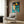 Modern pop art style wall poster depicting an astronaut on the lunar surface with vivid colors and geometric graphic treatment.