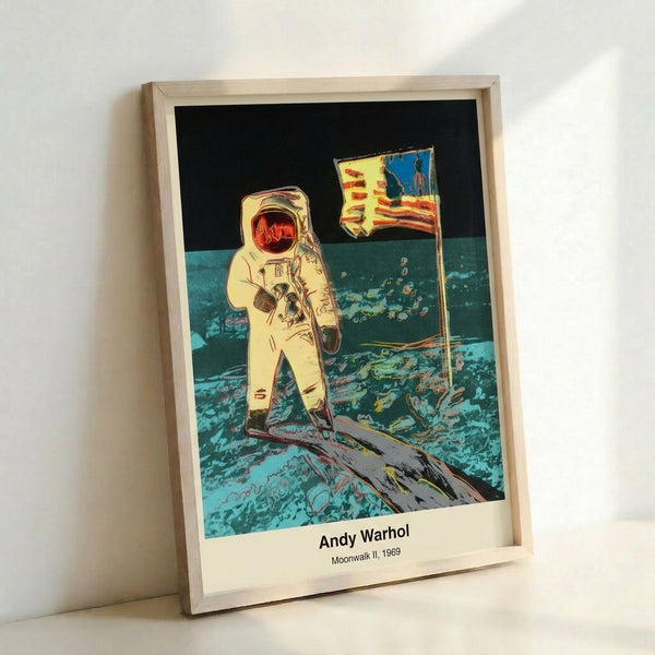 Bold black and white pop art poster depicting an astronaut on the moon's surface, framed on a wall as a striking modern art print inspired by the 1969 space exploration era.
