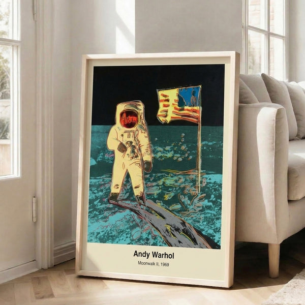Pop art space-themed poster featuring an astronaut figure rendered in monochromatic silver and black, framed as an iconic modern wall art piece celebrating the moon landing moment.