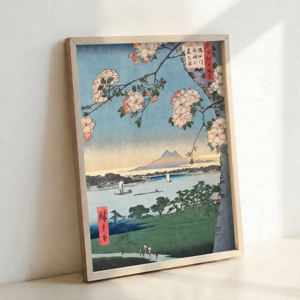 Traditional ukiyo-e inspired wall art showing cherry blossoms in full bloom beside a serene lake with Mount Fuji rising in the background, a shrine visible among forest greens and coral-pink flowering branches.