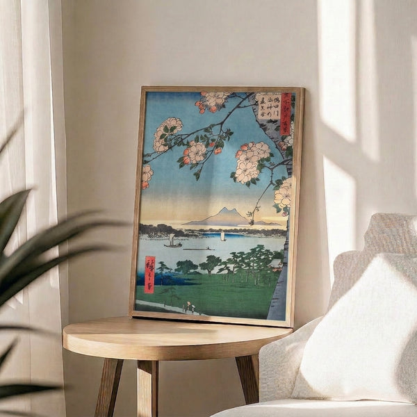 Framed woodblock print capturing the essence of spring renewal with cherry blossoms, sacred mountain, tranquil waters, and shrine; rendered in soft coral, charcoal, forest green, and pale blue.