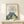 Japanese mountain landscape wall art print in minimalist woodblock tradition, capturing a tranquil sunrise over Fuji with contemplative mood in cream, sage green, and slate blue hues.