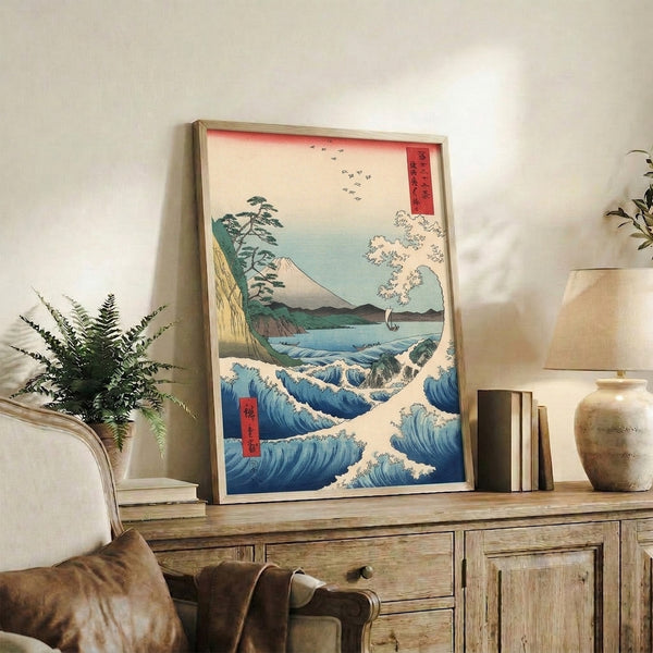 Traditional woodblock print capturing the majesty of sea and mountain with a small boat, pine trees, and birds against deep indigo and cream tones.