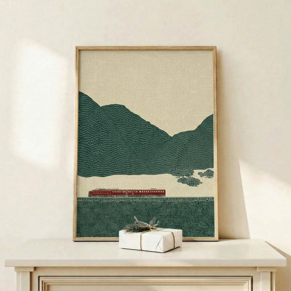 Framed vintage-style train landscape print featuring a burgundy locomotive winding through green mountains and trees in a contemplative minimalist design.