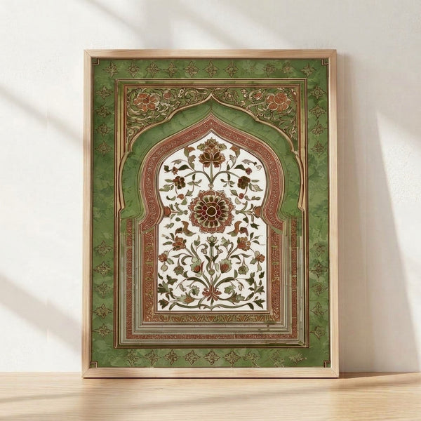 Framed art print of an ornate botanical arch with flowing vines, leaves, and flowers in sage green, terracotta, and cream on a wall, showcasing Art Nouveau and vintage Mughal manuscript styling.