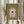Serene classical floral artwork in a frame displaying an arched composition of intertwining botanical motifs in olive and terracotta tones, blending Japandi and traditional manuscript aesthetics.