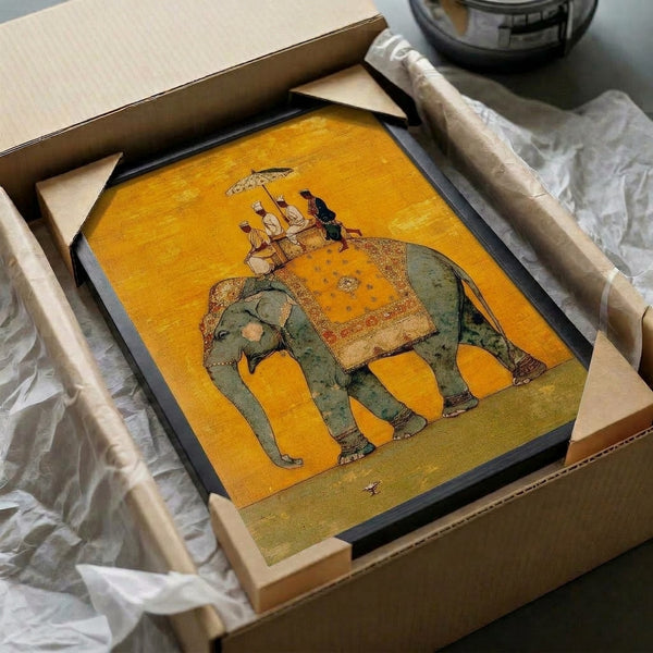 Vintage Mughal elephant procession art print framed on wall, depicting ornate imperial scene with cream, gold, and slate grey palette in traditional Indian miniature painting style.