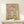 Romantic Islamic garden composition featuring an elegant archway entrance with flowering plants and distant dome, painted in dusty blue, terracotta, and soft pastels in a vintage boho style.